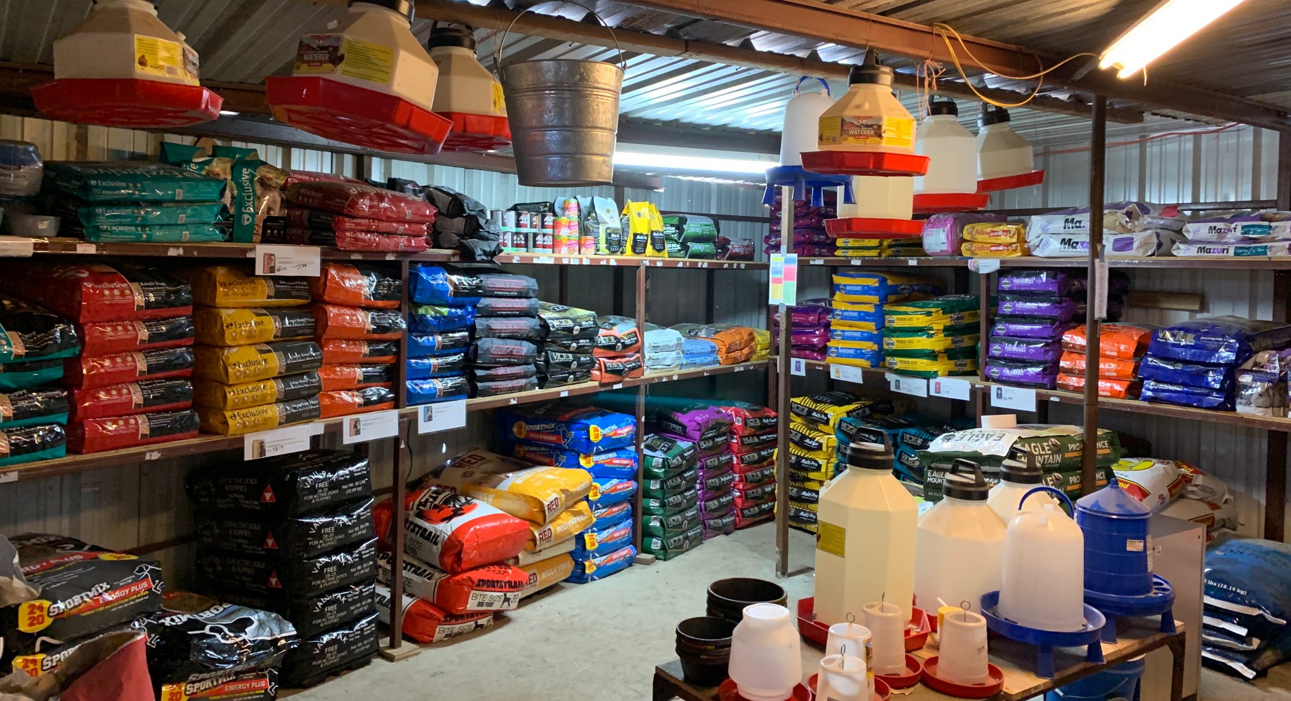 Bags of animal feed and supplies at Pasturas Los Alazanes in Dallas, Texas